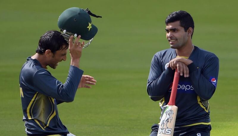 Pakistani cricketers Umar Akmal, right, and Younis Khan attend a practice session on Tuesday. They may, however, not play in Wednesday’s ODI. Aamir Qureshi / AFP