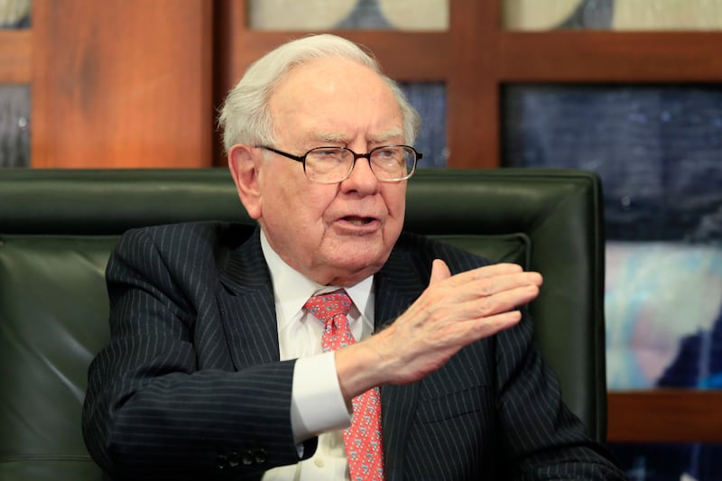 FILE - In a Monday, May 8, 2017, file photo, Berkshire Hathaway Chairman and CEO Warren Buffett speaks during an interview at the Fox Business Network in Omaha, Neb. Sempra Energy is buying Texas power transmitter Oncor for $9.45 billion in cash, wresting it away from Buffettâ€™s Berkshire Hathaway. Sempra said Monday, Aug. 21, that it will also pick up $9.35 billion of the companyâ€™s debt. (AP Photo/Nati Harnik, File)
