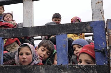 Families flee the Syrian regime's air strikes in Idlib, Syria. Bakr Alkasem for The National