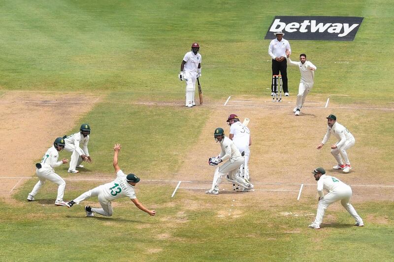 South Africa’s Wiaan Mulder, third from left, takes the catch off countryman Keshav Maharaj, top right, to dismiss Joshua de Silva, centre, of West Indies on day four of the second Test between the teams at Daren Sammy Cricket Ground, Saint Lucia. AFP