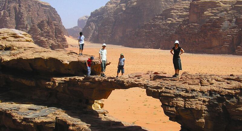 Handout: Family walking through the desert in Jordan (Courtesy Adventure Company)