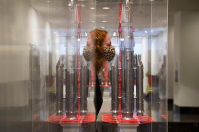 A gallery assistant walks past Gonogo by Goshka Macuga,  on display at the National Gallery, in London, one of the six artworks proposed as the next design for the Fourth Plinth at Trafalgar Square, in London, Monday May 24, 2021. (Kirsty O'Connor/PA via AP)