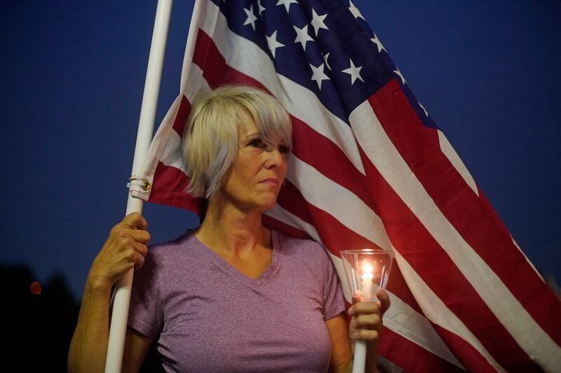 Tammy Merryweather looks on during the vigil for Hoover. AP