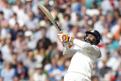 India's Ravindra Jadeja hits a boundary during play on the third day of the fifth Test cricket match between England and India at The Oval in London on September 9, 2018. (Photo by Adrian DENNIS / AFP) / RESTRICTED TO EDITORIAL USE. NO ASSOCIATION WITH DIRECT COMPETITOR OF SPONSOR, PARTNER, OR SUPPLIER OF THE ECB