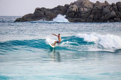 Surfing at Four Seasons Resort Seychelles. Courtesy Four Seasons Resort Seychelles