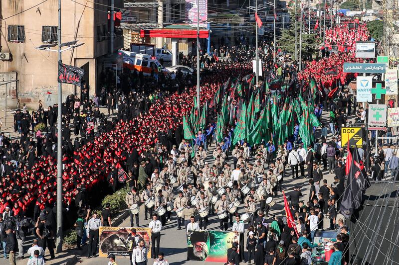 Members of the scouting movement and other Shiite Muslim devotees march in Lebanon's eastern city of Baalbeck.