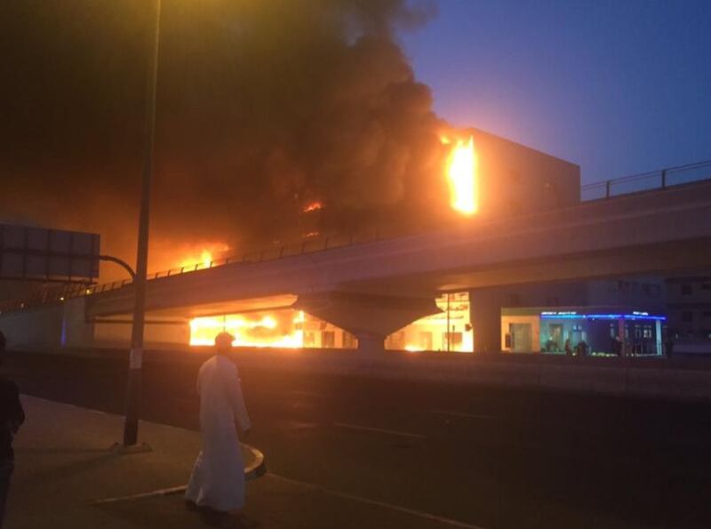 As the evening wore on, black smoke filling the air, nearby roads remained cordoned off as police warned the public against taking photos or filming the fire on their camera phones. Photo courtesy @sandierpastures via Twitter