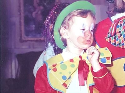 Camilla Fayed, in clown costume above as a child, has many of her father's traits and penchants, from theatricality and a passion for business to creating experiences and providing hospitality.