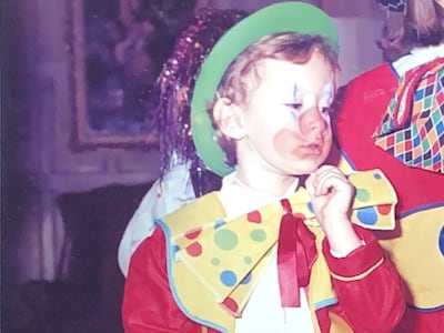 Camilla Fayed, in clown costume above as a child, has many of her father's traits and penchants, from theatricality and a passion for business to creating experiences and providing hospitality.