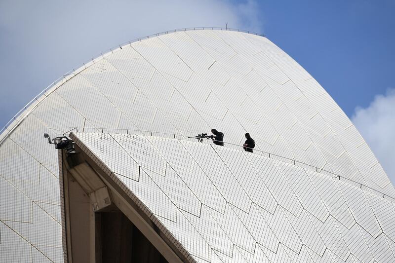 Police snipers are seen atop the Sydney Opera House. Reuters