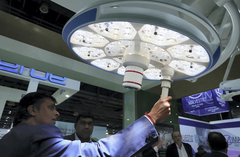 DUBAI, UNITED ARAB EMIRATES , Jan 29  – 2020 :- Visitors looking operation theatre lights at the Arab Health conference held at Dubai World Trade Centre in Dubai. ( Pawan  Singh / The National ) For News/Online. Story by Patrick