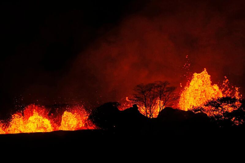 Lava erupts inside the Leilani Estates in Pahoa, Hawaii. Jamm Aquino / Honolulu Star-Advertiser via AP