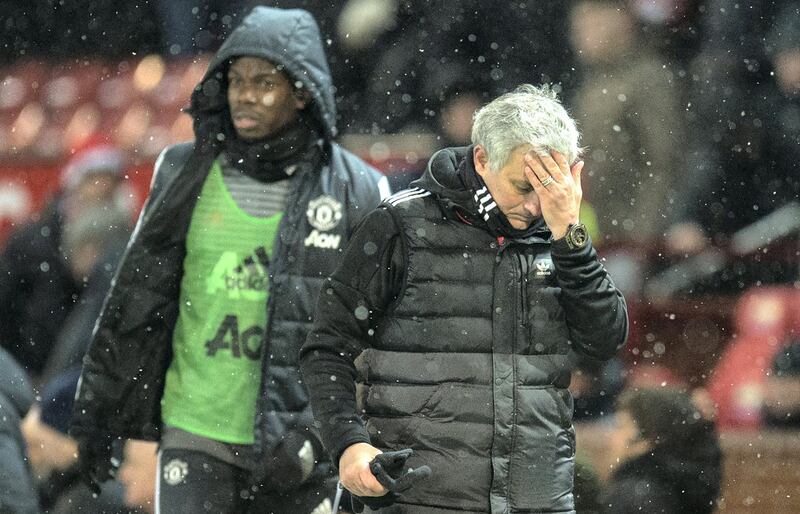 Manchester United's Portuguese manager Jose Mourinho (R) and French midfielder Paul Pogba leave after the English FA Cup quarter-final football match between Manchester United and Brighton and Hove Albion at Old Trafford in Manchester, north west England, on March 17, 2018. (Photo by Oli SCARFF / AFP) / RESTRICTED TO EDITORIAL USE. No use with unauthorized audio, video, data, fixture lists, club/league logos or 'live' services. Online in-match use limited to 75 images, no video emulation. No use in betting, games or single club/league/player publications. / 