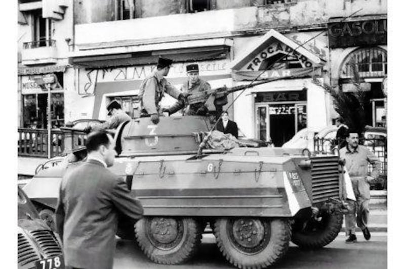 Armoured cars patrol the streets of Algiers in 1962 to prevent the occurence of violent outbreaks and incidents due to the upcoming declaration of a cease-fire in Algeria.