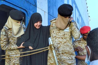 Saudi Navy personnel assist civilians being evacuated by Saudi Arabia from Sudan in Jeddah. SPA / Reuters