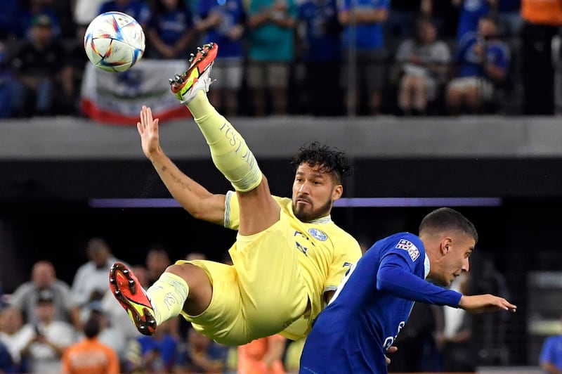 Club America defender Bruno Valdez attempts an acrobatic kick next to Chelsea forward Kai Havertz. AP