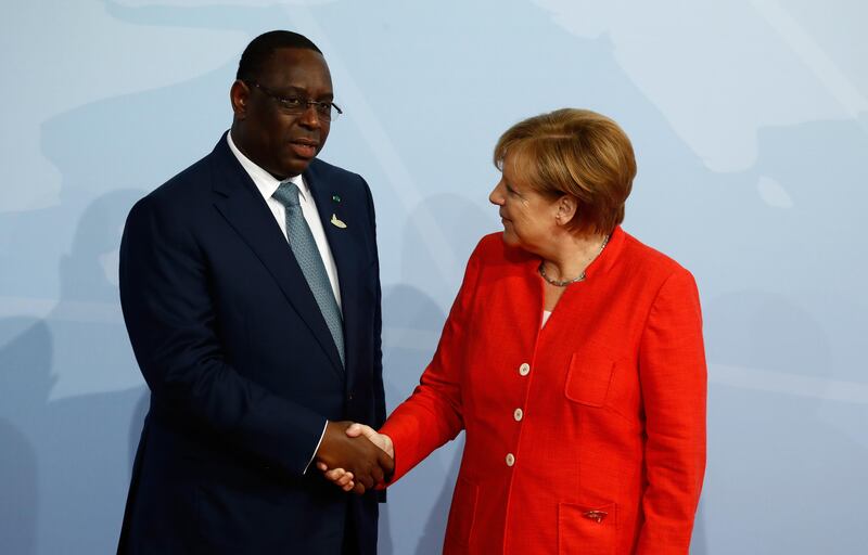With Senegalese president Macky Sall. Odd Andersen / AFP Photo