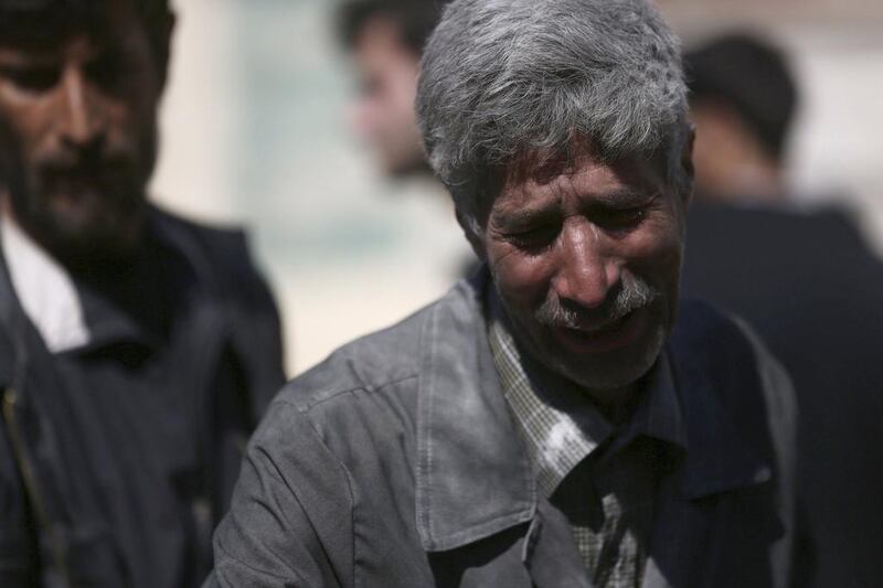 A man reacts after what activists said were eight air strikes by forces loyal to Syria's President Bashar al-Assad in Douma Eastern Al-Ghouta, near Damascus.  Bassam Khabieh / Reuters