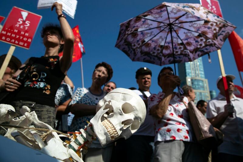 A model skeleton  on display during the Communist Party rally protesting retirement age hikes in Moscow, Russia, Sunday, Sept. 2, 2018. Several thousand people gathered in central Moscow on Sunday for a protest organized by the Communist Party and other demonstrations were reported in Vladivostok in the Far East and Barnaul and Novosibirsk in Siberia. (AP Photo/Pavel Golovkin)