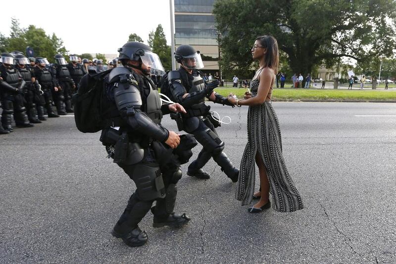 A demonstrator protesting the shooting death of Alton Sterling is detained by law enforcement in Baton Rouge, Louisiana.  Jonathan Bachman / Reuters
