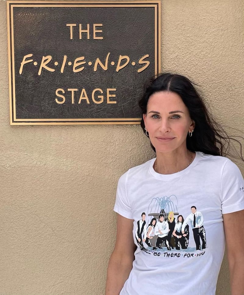 Courteney Cox, who played Monica in 'Friends', wears a 'We'll be there for you' T-shirt from the limited edition Cast Collection of merchandise