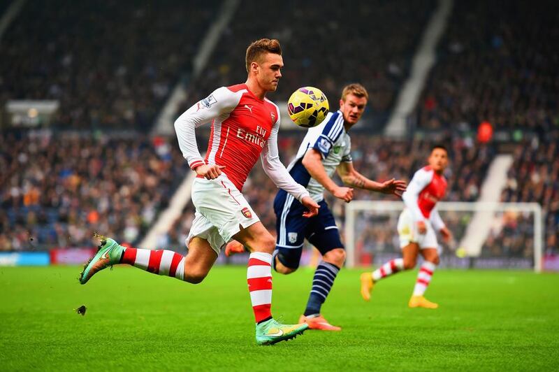 Calum Chambers of Arsenal and Chris Brunt of West Brom chase the ball during the Barclays Premier League match between West Bromwich Albion and Arsenal at The Hawthorns on November 29, 2014 in West Bromwich, England.  (Photo by Laurence Griffiths/Getty Images)