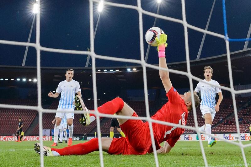 Zrurich’s Latvian goalkeeper Andris Vanins deflects a shot during the Europa League match against Osmanlispor. AFP / FABRICE COFFRINI