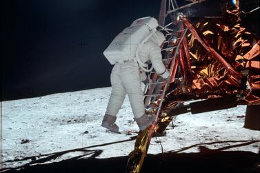 Buzz Aldrin descends a ladder onto the lunar surface during the Apollo 11 mission. NASA / AP