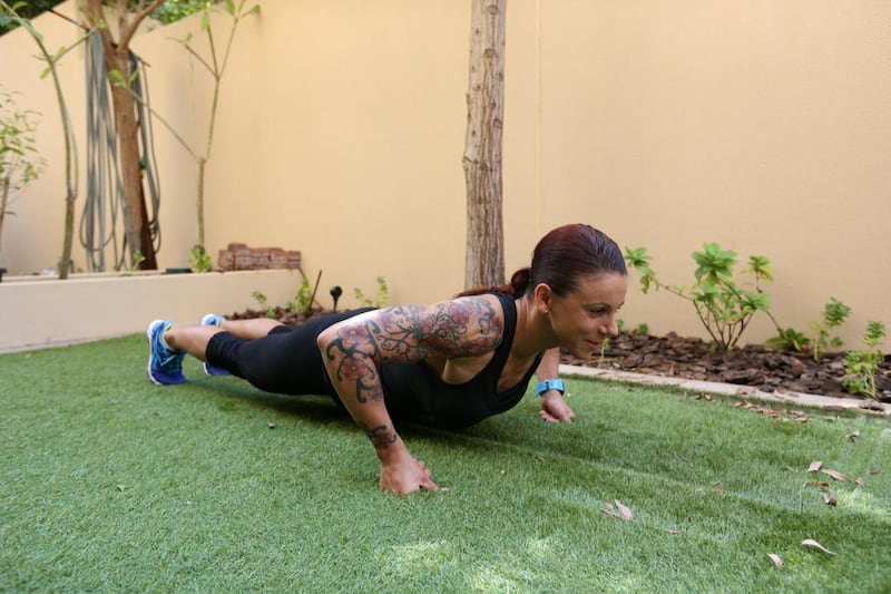 The most knuckle push ups in one hour by a female: Eva Clarke did 1,206 push ups at Wahda Mall, in Abu Dhabi. Fatima Al Marzooqi / The National.