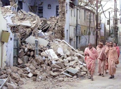A group of monks walk past rubble on a street in the western Indian city of Bhuj on January 27, 2001, after a powerful earthquake killed tens of thousands in the region. As many as 15,000 people may have died in the massive quake which struck on Friday, the Indian Defence Minister was quoted as saying.

PK/JD