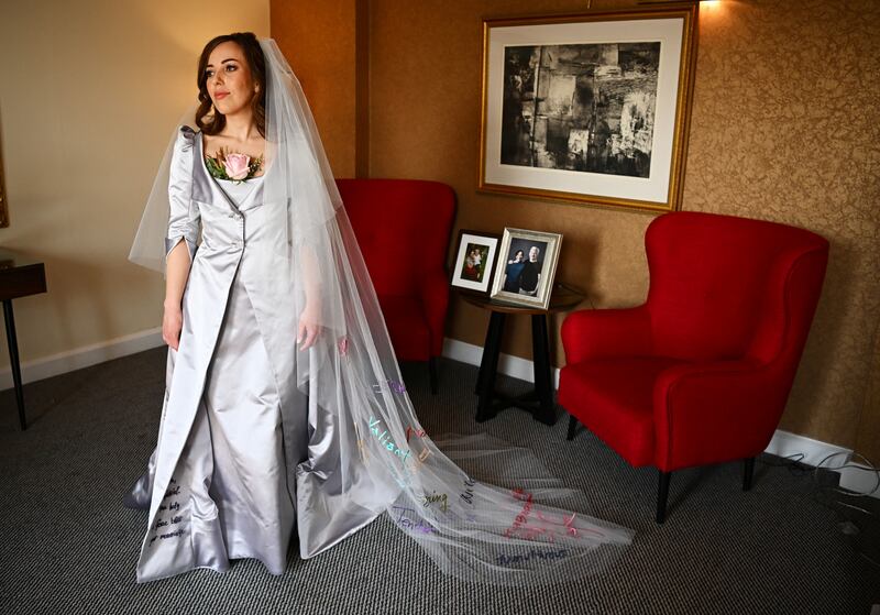 Stella Moris poses in her wedding dress. PA