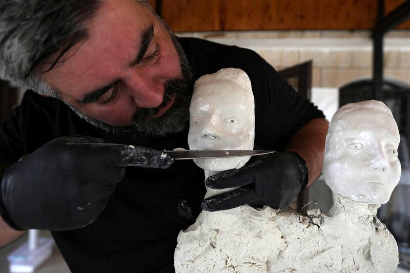 Omar Sartawi, a Jordanian chef, recreates an ancient statue found in Jordan using a famous local product - Jameed (dried goat's milk used in the country's national dish), at his workshop in Amman, Jordan. REUTERS