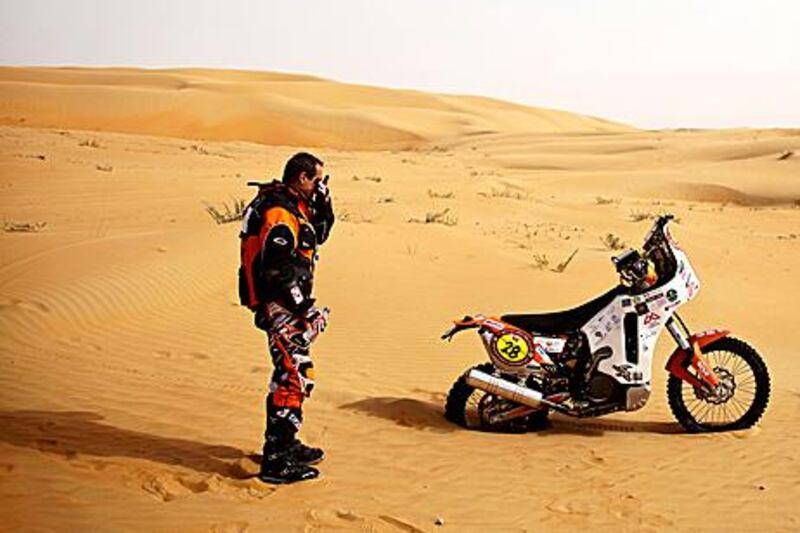 Motocross rider Giovanni Ronzoni is overcome with emotion as he realises he will not be able to complete the third stage of the Abu Dhabi Desert Challenge in the Empty Quarter.