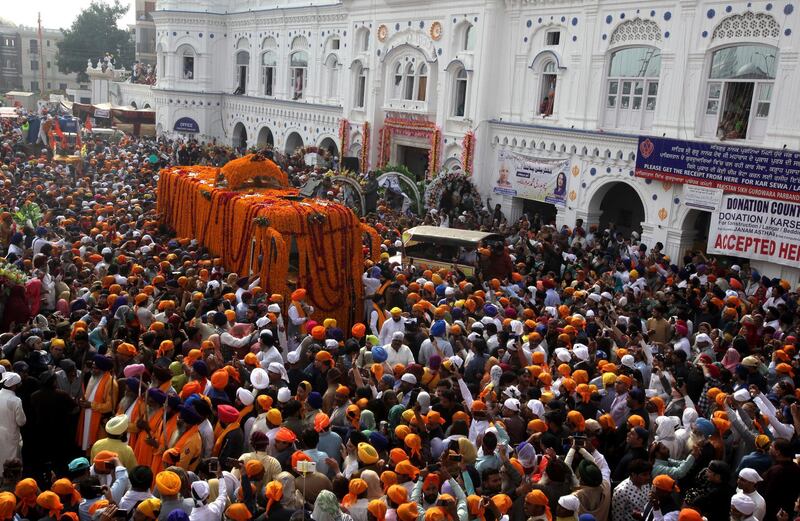 Sikh pilgrims attend a religious festival to celebrate the 550th birth anniversary of Sikhism's founder, Guru Nanak Dev, at Nankana Sahib near Lahore, Pakistan, Tuesday, Nov. 12, 2019. AP