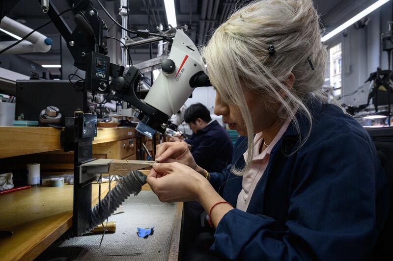 Workers at Tiffany’s jewellery factory in New York City. US job gains topped expectations in October, but inflation remains a major concern. AFP