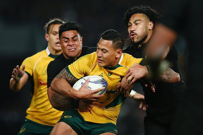 Israel Folau of Australia is tackled by Malakai Fekitoa and Ma'a Nonu of New Zealand during The Rugby Championship, Bledisloe Cup match between the New Zealand All Blacks and the Australian Wallabies at Eden Park on August 15, 2015 in Auckland, New Zealand. (Photo by Anthony Au-Yeung/Getty Images) 