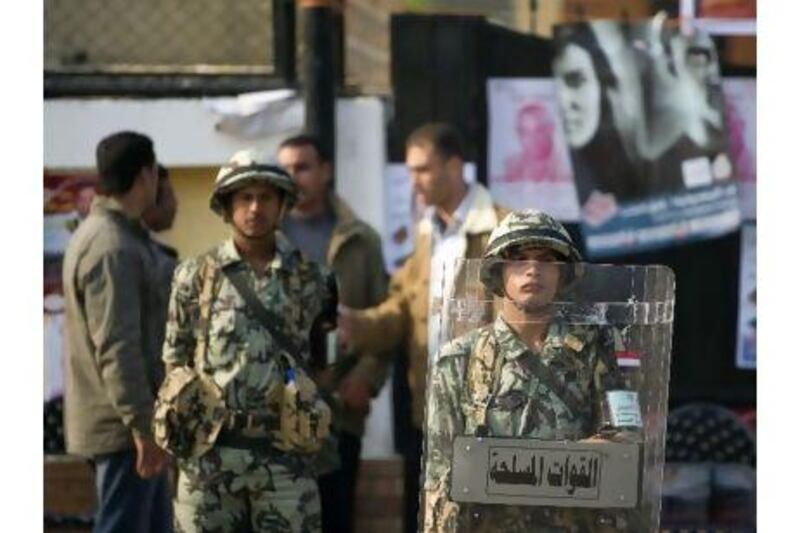 Readers disagree whether Egypt's military is a roadblock or a guarantor of secularism. Odd Andersen / AFP