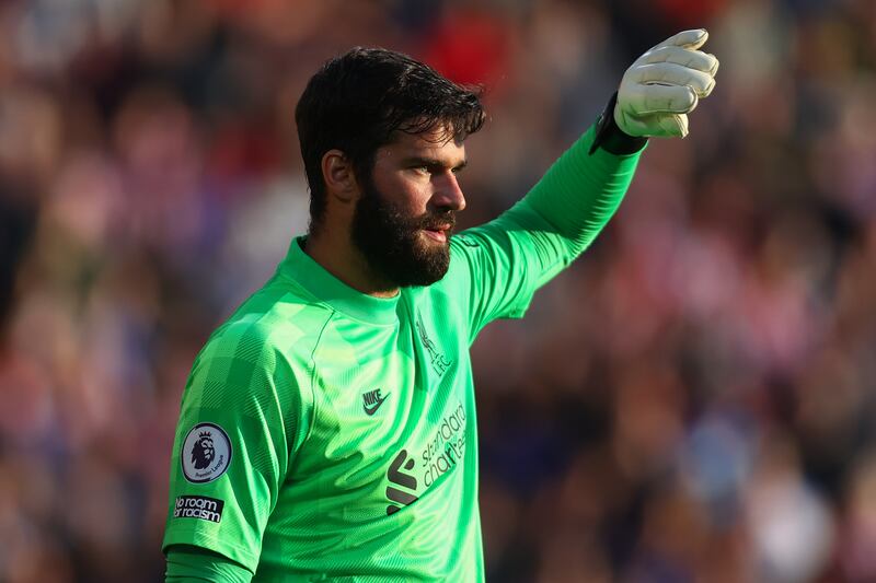 LIVERPOOL PLAYER RATINGS: Alisson Becker - 6. The Brazilian could have done better for all three Brentford goals. He needed to take control in the air. Getty Images