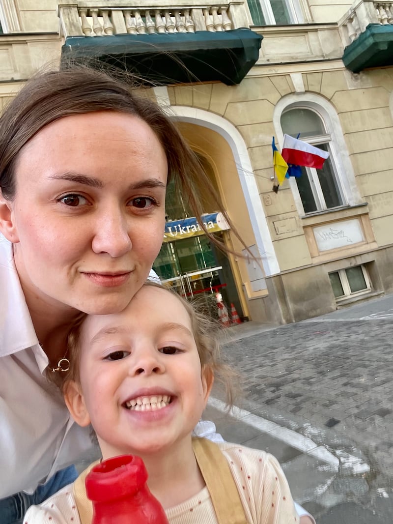 Alexandra Iliashenko, a Ukrainian mother with her daughter Mykhailyna outside a consultancy service in Warsaw, Poland that also provides support to families who have fled the war in Ukraine. Photo: Diia.Business