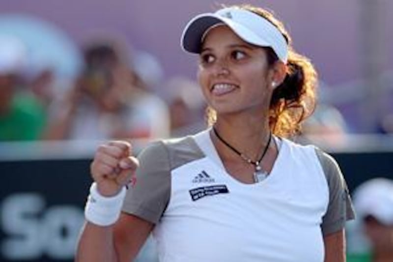 Sania Mirza celebrates after winning her semi-final against Magdalena Rybarikova.