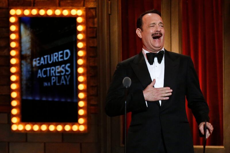 Actor Tom Hanks reacts before presenting the award for Best Performance By an Actress in a Featured Role in a Play during the American Theatre Wing's annual Tony Awards in New York June 9, 2013. REUTERS/Lucas Jackson (UNITED STATES - Tags: ENTERTAINMENT) (TONYS-SHOW) *** Local Caption ***  AAL115_STAGE-TONYAW_0610_11.JPG