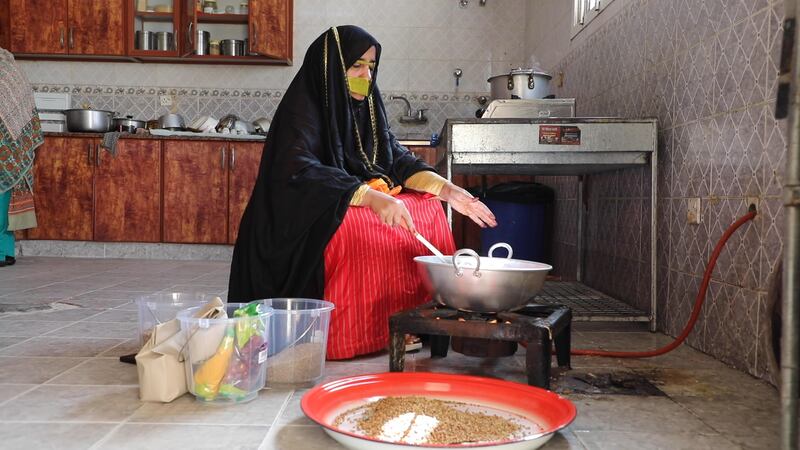 Emirati women prepare traditional food for a competition to showcase UAE's heritage at Sheikh Zayed Festival. All photos: Nilanjana Gupta / The National