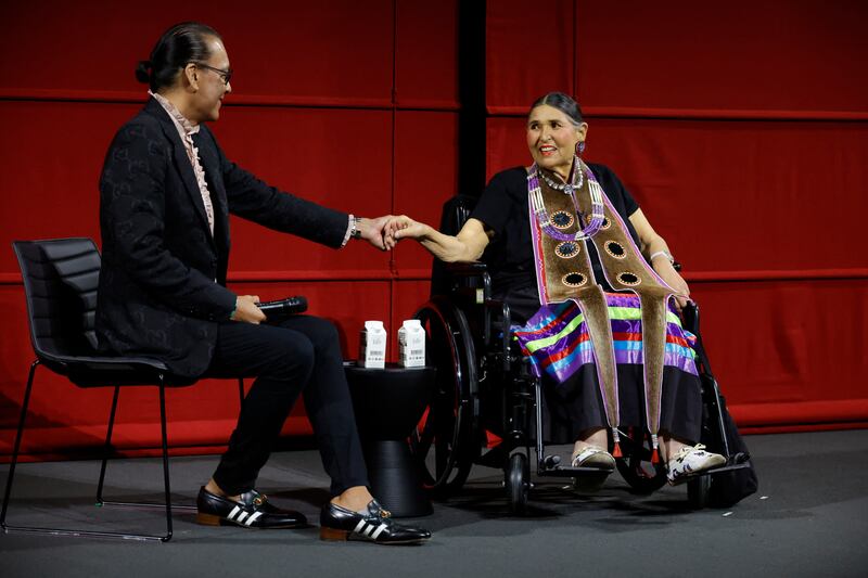 Bird Runningwater, left, co-chair of the Academy's Indigenous Alliance on stage with Littlefeather at Ampas Presents An Evening with Sacheen Littlefeather at Academy Museum of Motion Pictures on September 17, 2022 in Los Angeles, California. AFP