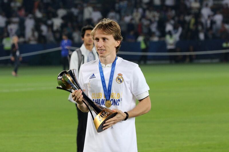 Luka Modric holds the Fifa Club World Cup trophy after Real Madrid's victory over Gremio in Abu Dhabi. EPA