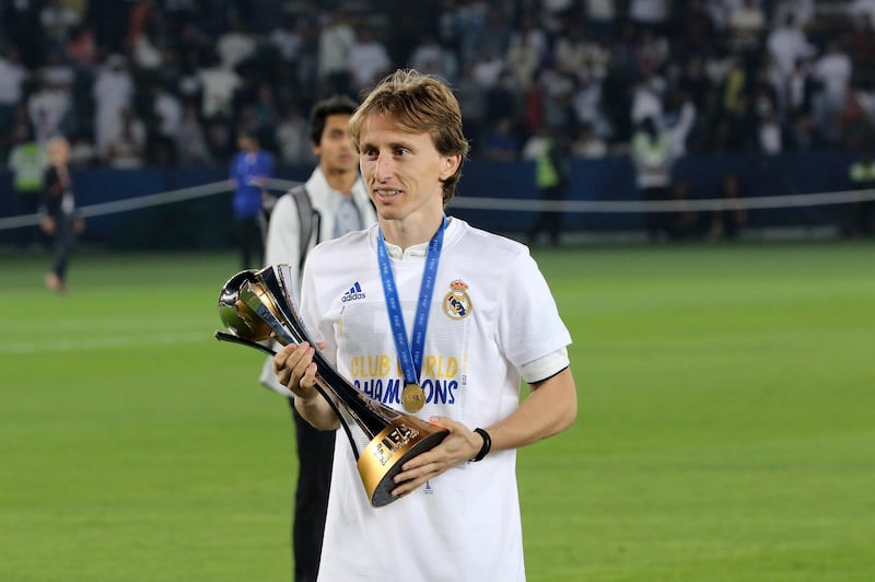 Luka Modric holds the Fifa Club World Cup trophy after Real Madrid's victory over Gremio in Abu Dhabi. EPA