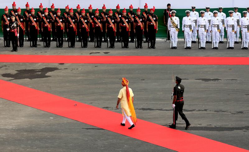 Mr Modi inspects an honour guard. Harish Tyagi / EPA