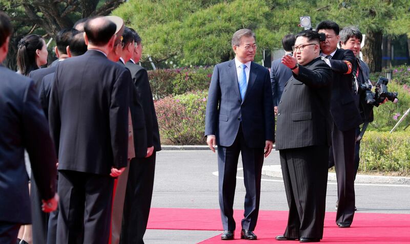 The leaders get ready to inspect a honour guard Korea Summit Press Pool via AP