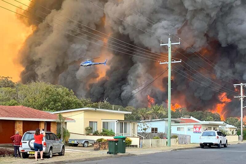 This handout picture taken and received from Kelly-ann Oosterbeek on November 8, 2019 shows flames from an out of control bushfire seen from a nearby residential area in Harrington, some 335 kilometers northeast of Sydney.  Australian firefighters warned they were in "uncharted territory" as they struggled to contain dozens of out-of-control bushfires across the east of the country on November 8.
 - RESTRICTED TO EDITORIAL USE - MANDATORY CREDIT "AFP PHOTO / KELLY-ANN OOSTERBEEK" - NO MARKETING NO ADVERTISING CAMPAIGNS - DISTRIBUTED AS A SERVICE TO CLIENTS == NO ARCHIVE

 / AFP / Kelly-ann Oosterbeek / Kelly-ann Oosterbeek / RESTRICTED TO EDITORIAL USE - MANDATORY CREDIT "AFP PHOTO / KELLY-ANN OOSTERBEEK" - NO MARKETING NO ADVERTISING CAMPAIGNS - DISTRIBUTED AS A SERVICE TO CLIENTS == NO ARCHIVE

