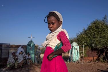 A Tigrayan girl who fled the conflict in Ethiopia's Tigray region, prepares to leave after Sunday Mass ends at a church, near Umm Rakouba refugee camp in Qadarif, eastern Sudan. AP