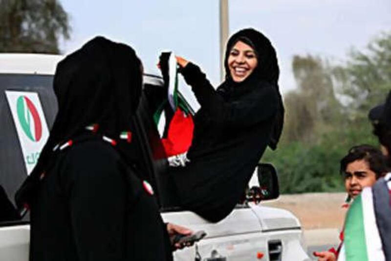 Huda Al Gabree celebrates the UAE's 37th anniversary in Fujairah. She was part of a group of eight Emirati women who participated in a National Day drive through all seven Emirates to raise awareness of breast cancer.